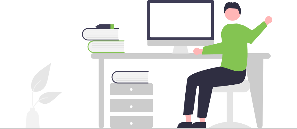 man sitting at desk waving