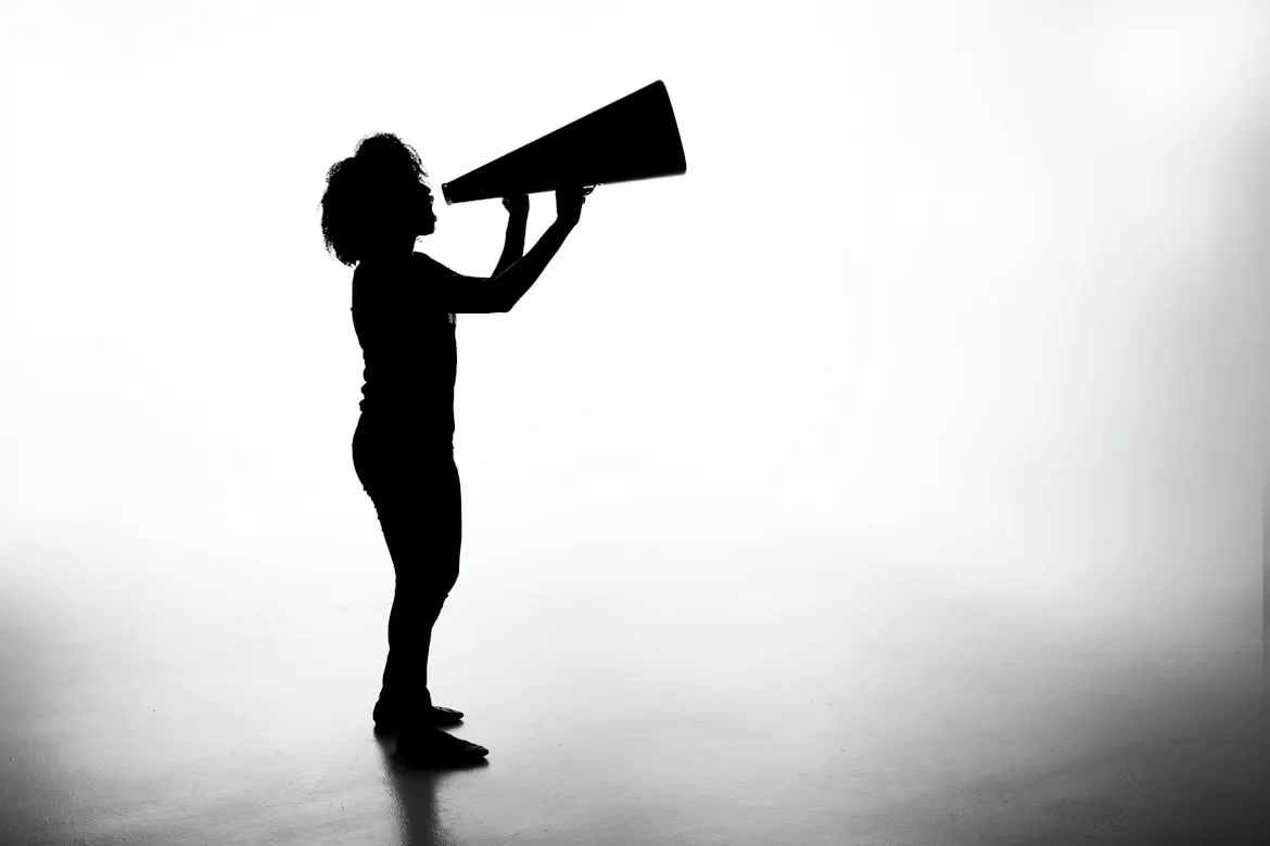silhouette shouting in megaphone